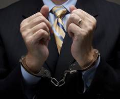 executive in handcuffs