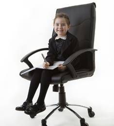 little girl in office chair