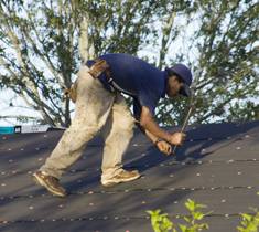 man fixing roof