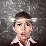 Woman with a concerned expression on her face and the word "tax" swirling around her head