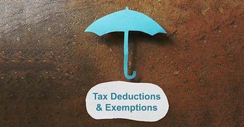 Underneath a paper cutout of an umbrella is the phrase "tax deductions & exemptions"